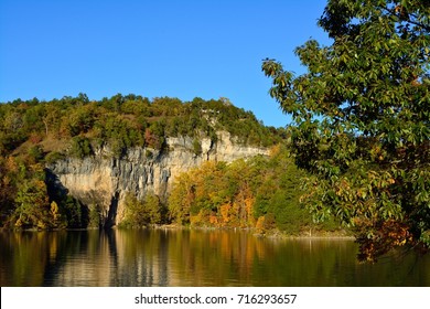 A cliff rises above a reservoir in Missouri.