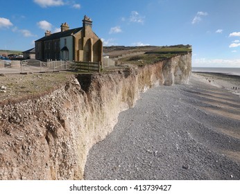 Cliff top cottages at risk from coastal erosion. Birling gap on the southern English coast near Eastbourne, February 2016.