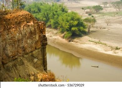cliff view river small speed boat country side 