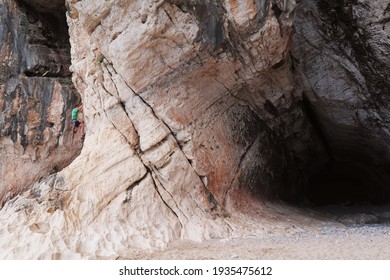 Cliffhanger Trying To Reach Top At Cala Luna Beach