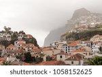 Cliffs by the bay and beach at Camara de Lobos on island of Madiera