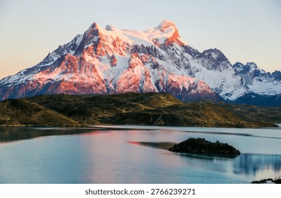 Cliffs of Los Kuernos reflection during sunrise at Lake Pehoe in National Park Torres del Paine, Patagonia, Chile