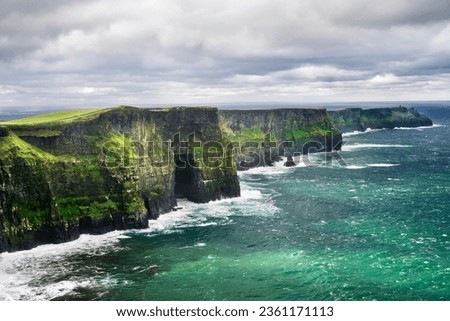Cliffs of Moher is a famous tourist attraction on Wild Atlantic Way along the Atlantic coast of Ireland.