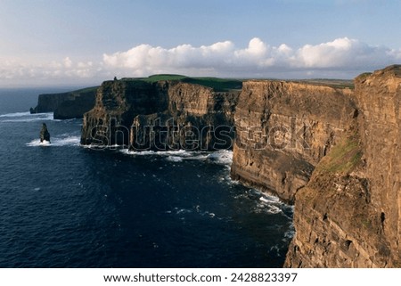 The cliffs of moher, rising to 230m in height, o'brians tower and breanan mor seastack, looking from hags head, county clare, munster, eire (republic of ireland), europe