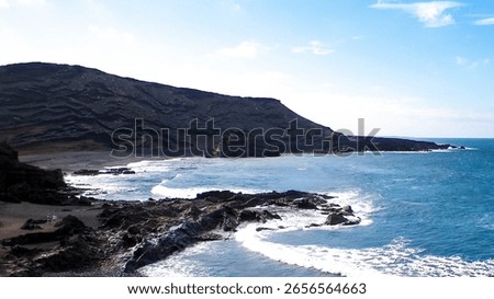 Cliffs over El Golfo Beach. Lanzarote Island. Popular touristic attraction.