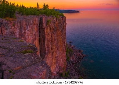 The cliffs of Palisade Head towering over Lake Superior at sunset. Tettegouche State Park, Minnesota. - Shutterstock ID 1934209796