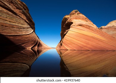 cliffs reflecting in the water surface in the wave arizona 