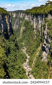 Cliffs, river and waterfall in Itaimbezinho Canyon, Cambara do Sul, Rio Grande do Sul, Brazil