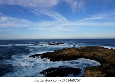cliffs, rugged, dramatic, coastal, windswept, rocky, steep, towering, ocean, waves, crashing, erosion, jagged, horizon, wild, natural, scenic, breathtaking, misty, windy, saltwater, shoreline, precipice, height, abyss, panoramic, remote, untamed, serene, vast, geological, strata, layers, ancient, formation, edge, vertical, sheer, drop, foam, tide, seascape, isolation, beauty, powerful, nature, erosion, winds, spray