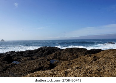 cliffs, rugged, dramatic, coastal, windswept, rocky, steep, towering, ocean, waves, crashing, erosion, jagged, horizon, wild, natural, scenic, breathtaking, misty, windy, saltwater, shoreline, precipice, height, abyss, panoramic, remote, untamed, serene, vast, geological, strata, layers, ancient, formation, edge, vertical, sheer, drop, foam, tide, seascape, isolation, beauty, powerful, nature, erosion, winds, spray