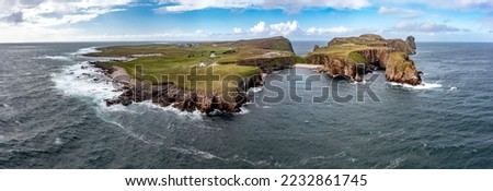 The cliffs and sea stacks An Tor Mor and the Wishing Stone at Port Challa on Tory Island, County Donegal, Ireland