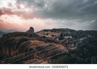 The Cliffside Hamlet Amidst Stormy Skies - Powered by Shutterstock