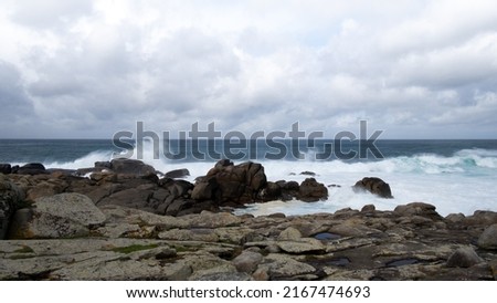 cliffside horizon of the atlantic ocean at muxia on the death coast in spain. stormy sea, cloudy sky and white band at the top with space for text. copy space. banner. photo format in 16: 9