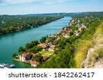 cliffside views over the west lake landscape from Mount Bonnell views of colorful rooftops and mansions in nature in Austin , Texas , USA