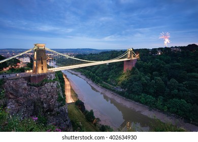 The Clifton Suspension bridge at night with fireworks going off on the other side (Ashton Court). 