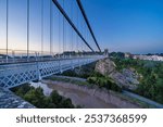 Clifton suspension bridge over Avon Gorge at dusk. Bristol, UK