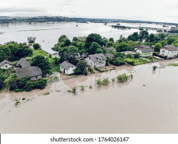 Climate change and the effects of global warming. Flooded houses, streets, farms and fields after heavy rains. Environmental natural disaster. Concept of global catastrophes in the world