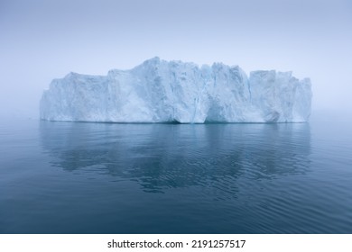 Climate change and global warming. Icebergs from a melting glacier in Antarctica. The icy landscape of the Arctic nature in the UNESCO world heritage site.
