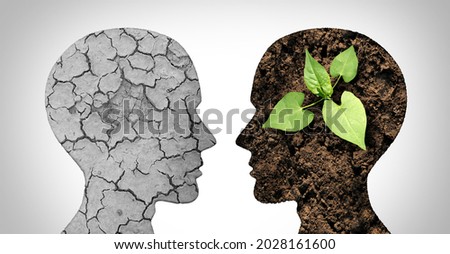 Climate change psychology as a dried or dry cracked land suffering from drought versus rich moist organic earth with a growing young plant in the shape of a human head as a composite.