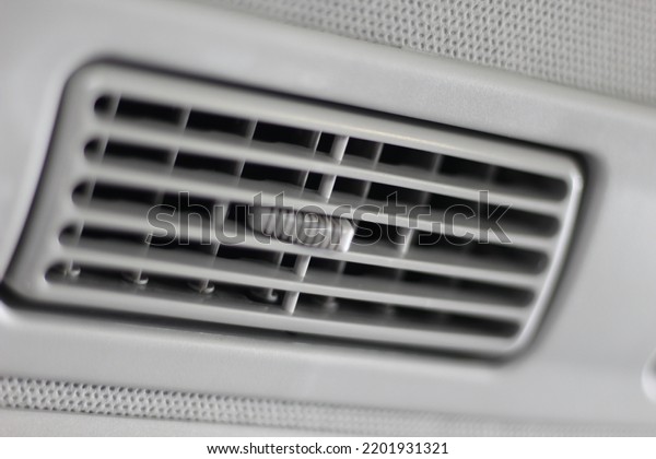 Climate\
control AC unit in the car. Modern car interior details. Air\
conditioning button inside a car. close\
up