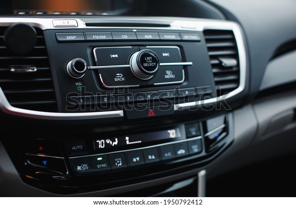 Climate control in auto. Car interior detail.\
Multimedia, navigation, audio\
controls.