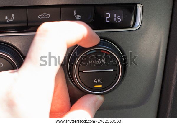 climate control in a modern car, switching on AC\
in hot weather