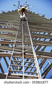 Climber Ascending Cell Phone Tower. Wisconsin, USA.