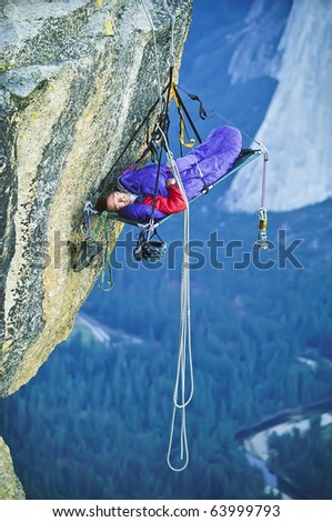 Similar – Rock climbing team bivouaced in a storm.