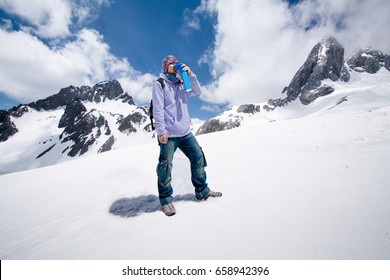 Climber Breathing With Mini Portable Oxygen Cylinder To Avoid And Treat High Altitude Sickness Symptom