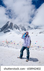 Climber Breathing With Mini Portable Oxygen Cylinder To Avoid And Treat High Altitude Sickness Symptom