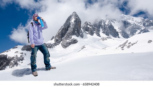 Climber Breathing With Mini Portable Oxygen Cylinder To Avoid And Treat High Altitude Sickness Symptom