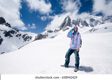 Climber Breathing With Mini Portable Oxygen Cylinder To Avoid And Treat High Altitude Sickness Symptom