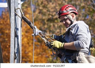 Climber On Cell Tower In Autumn Scennery