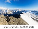 Climber on south ridge of dent blanche, 4357m, with view to the matterhorn, valais, swiss alps, switzerland, europe