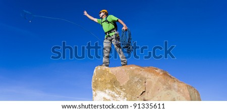 Similar – Climber reaching for a helping-hand.