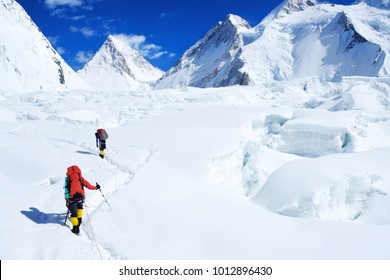 Climber reaches the summit of Everest. Mountain peak Everest. Highest mountain in the world. National Park, Nepal - Shutterstock ID 1012896430