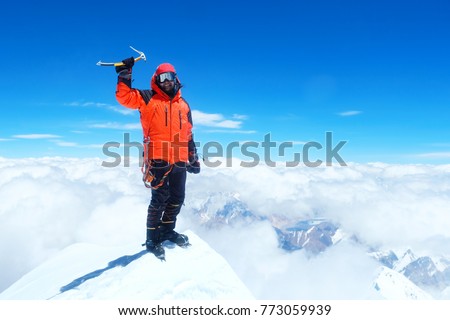 Climber  reaches the summit of Everest. Mountain peak Everest. Highest mountain in the world. National Park, Nepal 
