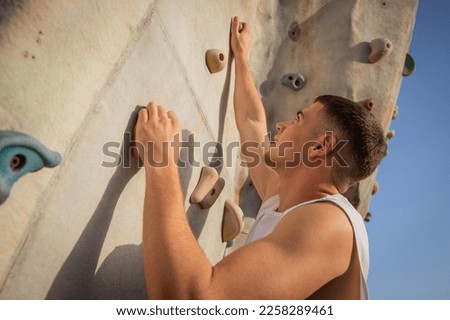 A climber trains and climbs a wall, photo with copy space Foto stock © 