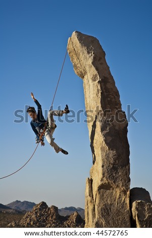 Similar – Climber reaching for a helping-hand.