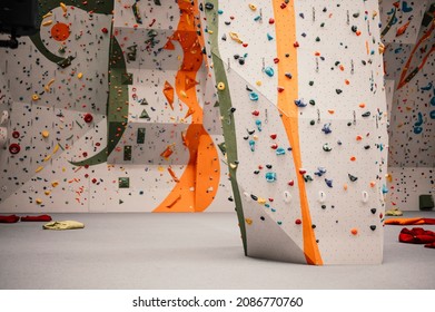 Climber wearing in climbing equipment. Practicing rock-climbing on a rock wall indoors. Xtreme sports and bouldering concept. - Shutterstock ID 2086770760