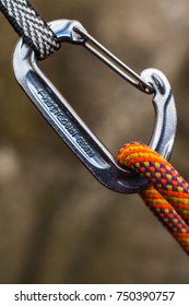 A Climbing Carabiner And A Rope