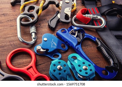 Climbing Equipment Outdoor For A Mountain Trip Or Rescue
With Rope Carabiners Ascender Belay/rappel Device, Over Concrete Background With Copy Space On Wooden Background, Top View. Travel Concept