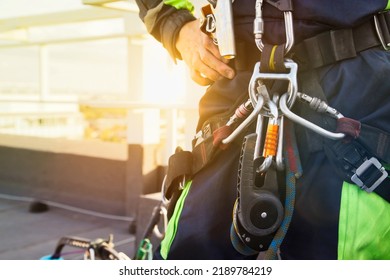 Climbing Equipments Before Starting Job. Equipment Of Industrial Mountaineer Worker On Roof Of Building During Industry High-rise Work. Rope Laborer Access. Concept Of Urban Works. Copy Space