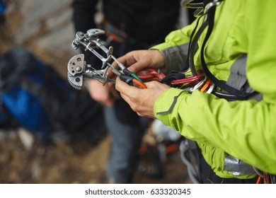 Climbing friends in the hands of a climber closeup. Climbing gear and equipment. - Powered by Shutterstock