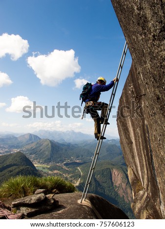 Similar – Rock climbing team bivouaced in a storm.