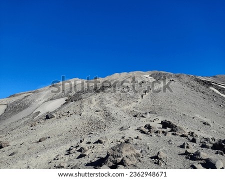 Climbing Mount St Helens with a view of Mount Adams 