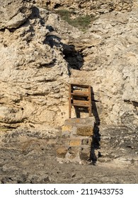 Climbing The Mountains. Rocky Stones. Wooden Ladder On The Path. Climb Up. No People. Bright Sunny Weather. Vertical