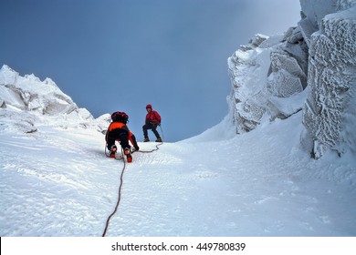 Climbing In Mountains. Team Work.