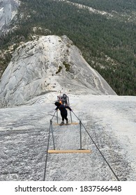 Climbing On The Top Of The Half Dome, Yosemite National Park, Climbing The Cables