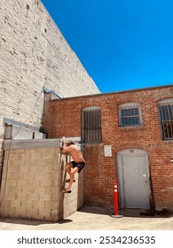 Climbing up the side of the building 